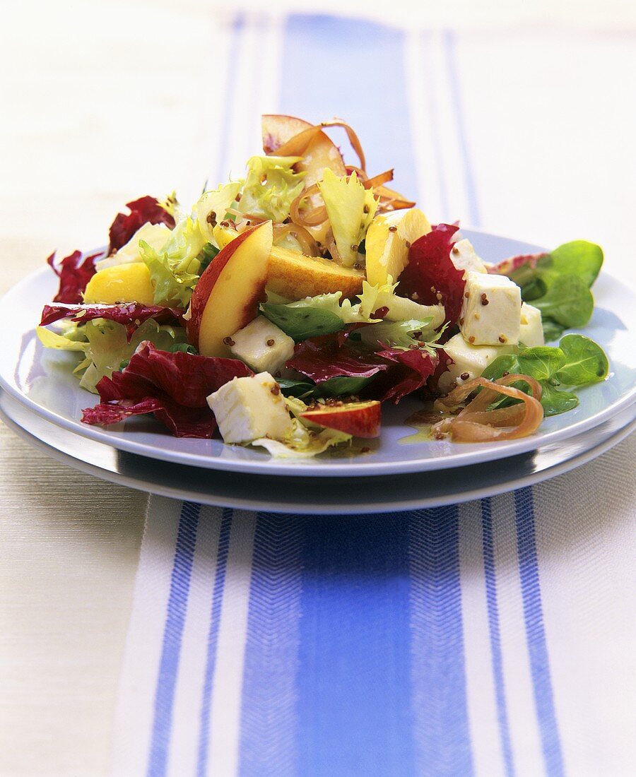 Salad leaves with cheese and nectarines