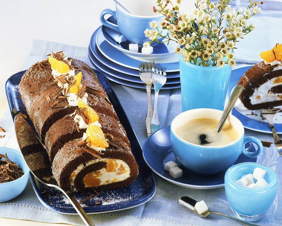 Chocolate and mandarin roulade, black coffee and sugar cubes
