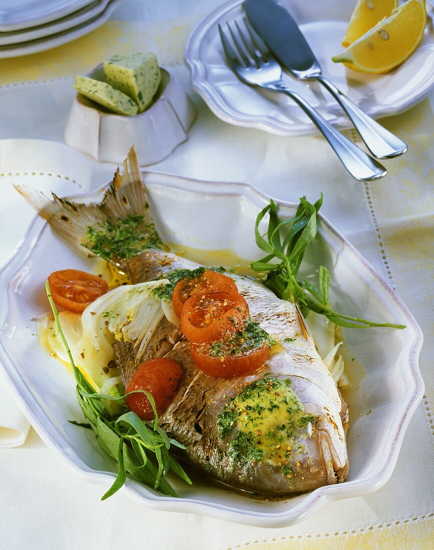 Sea bream cooked in foil with fennel and herb butter