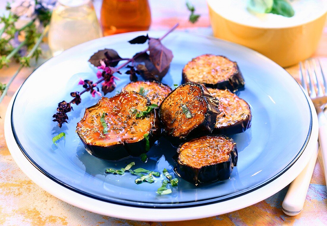 Spicy fried aubergine slices with herbs