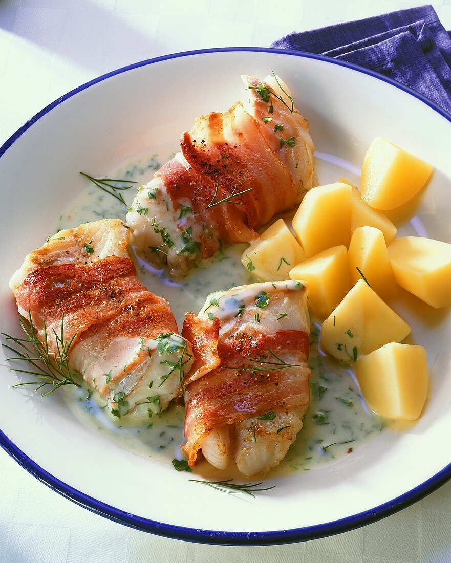 Ling fillet wrapped in bacon with herb cream sauce