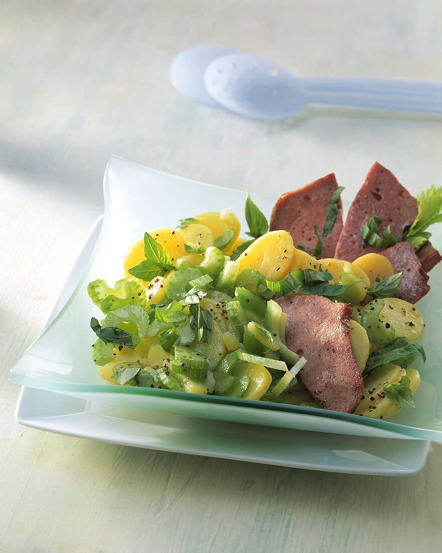 Potato salad with celery and liver cheese (meatloaf)
