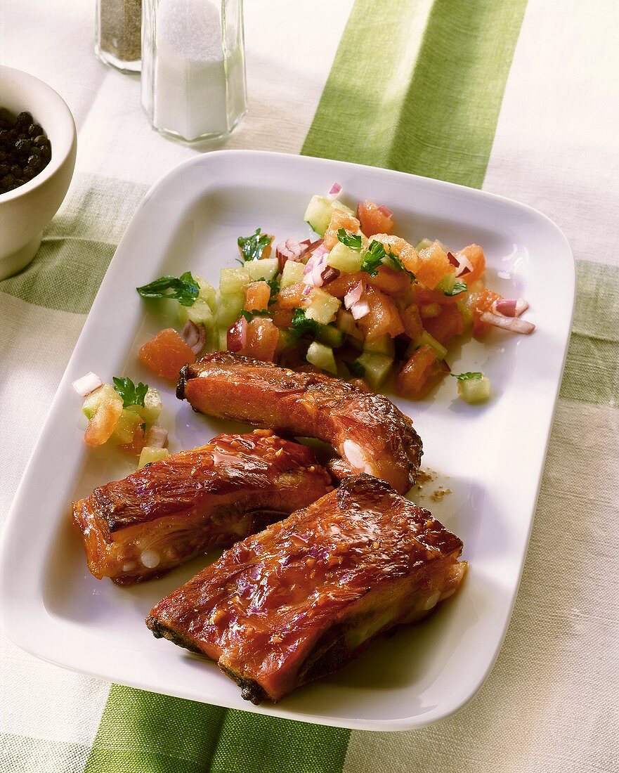 Spare ribs with tomato and cucumber salsa