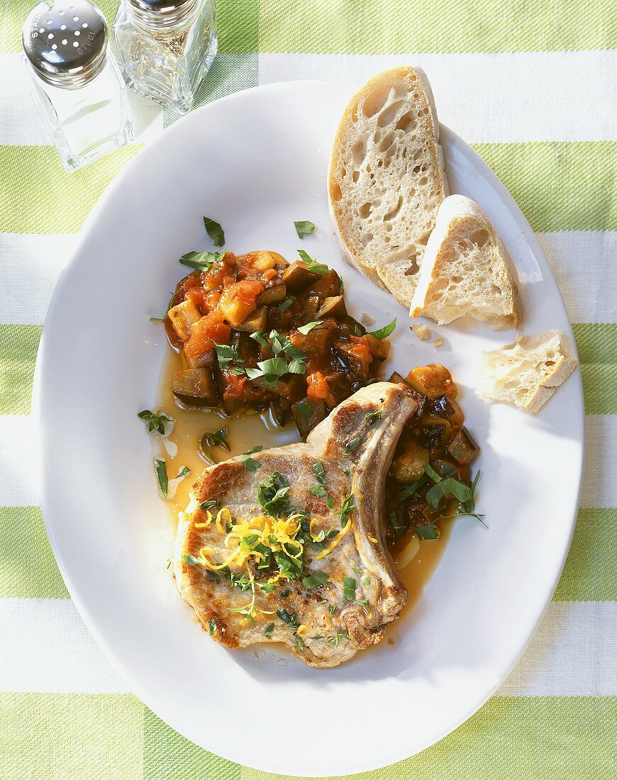 Thyme cutlet with aubergines and tomatoes