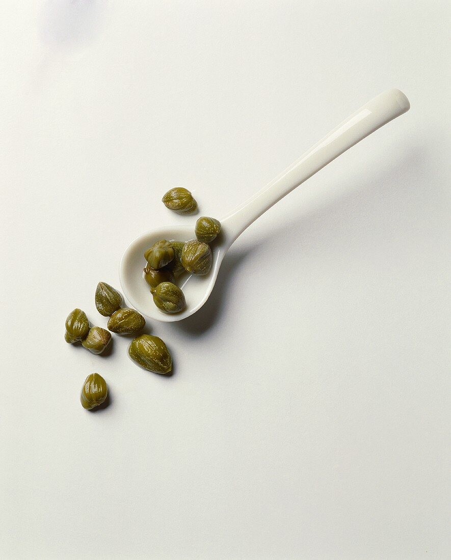 Capers on a spoon and beside it