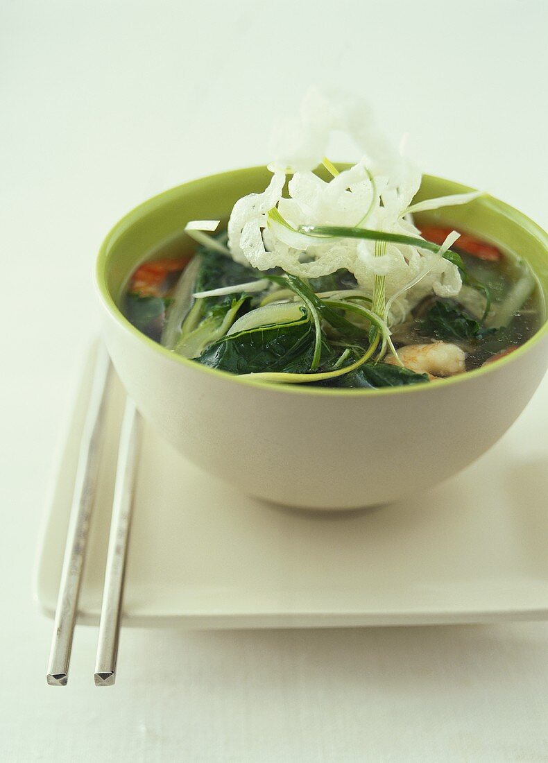 Asian soup with pak choi and deep-fried glass noodles