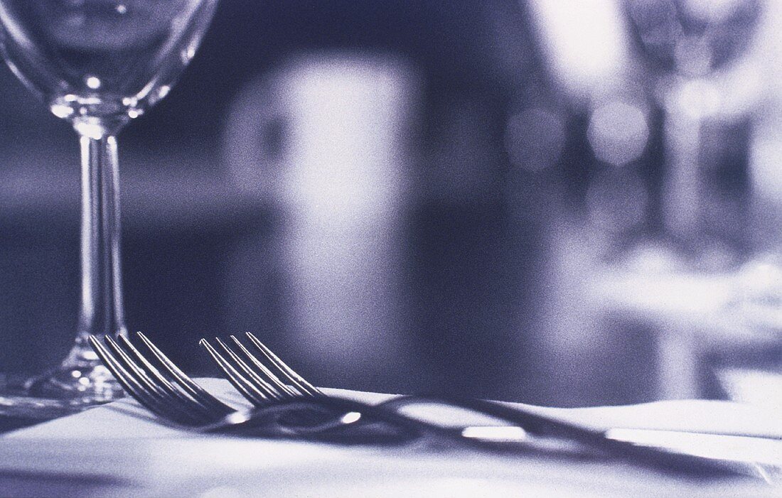 Two forks and a glass (black and white photo)