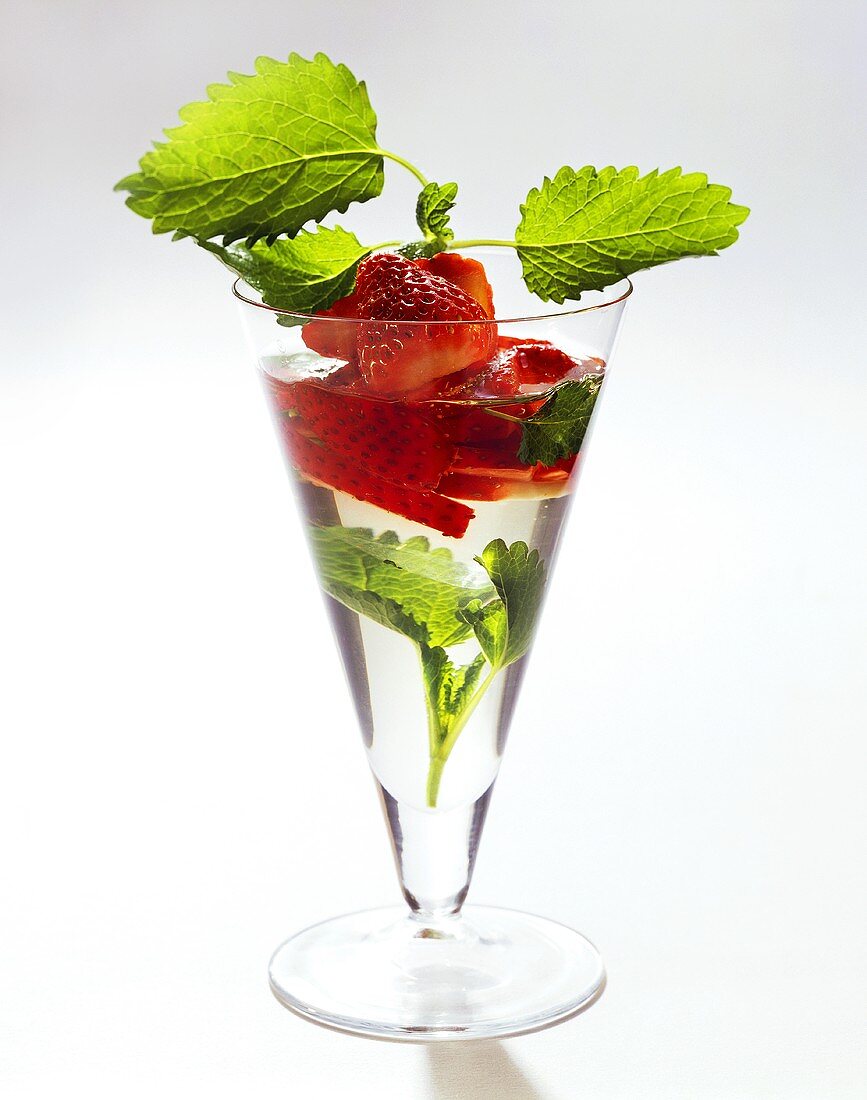 Fresh strawberries in elderflower liqueur jelly
