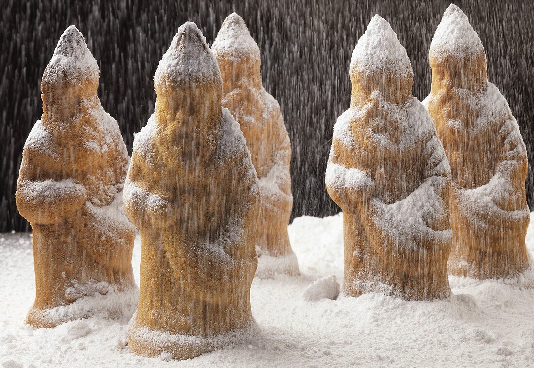 Sponge Father Christmases standing in icing sugar snow