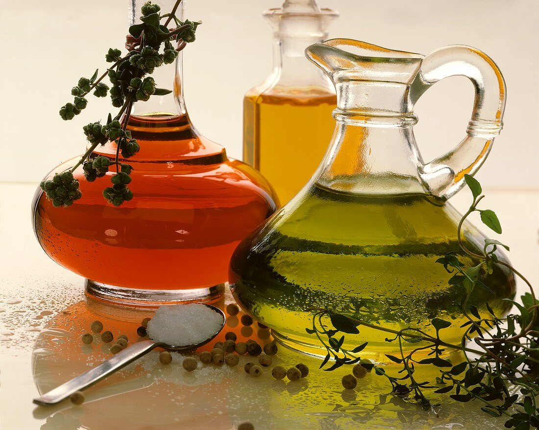 Herb oil and vinegar in decorative bottles