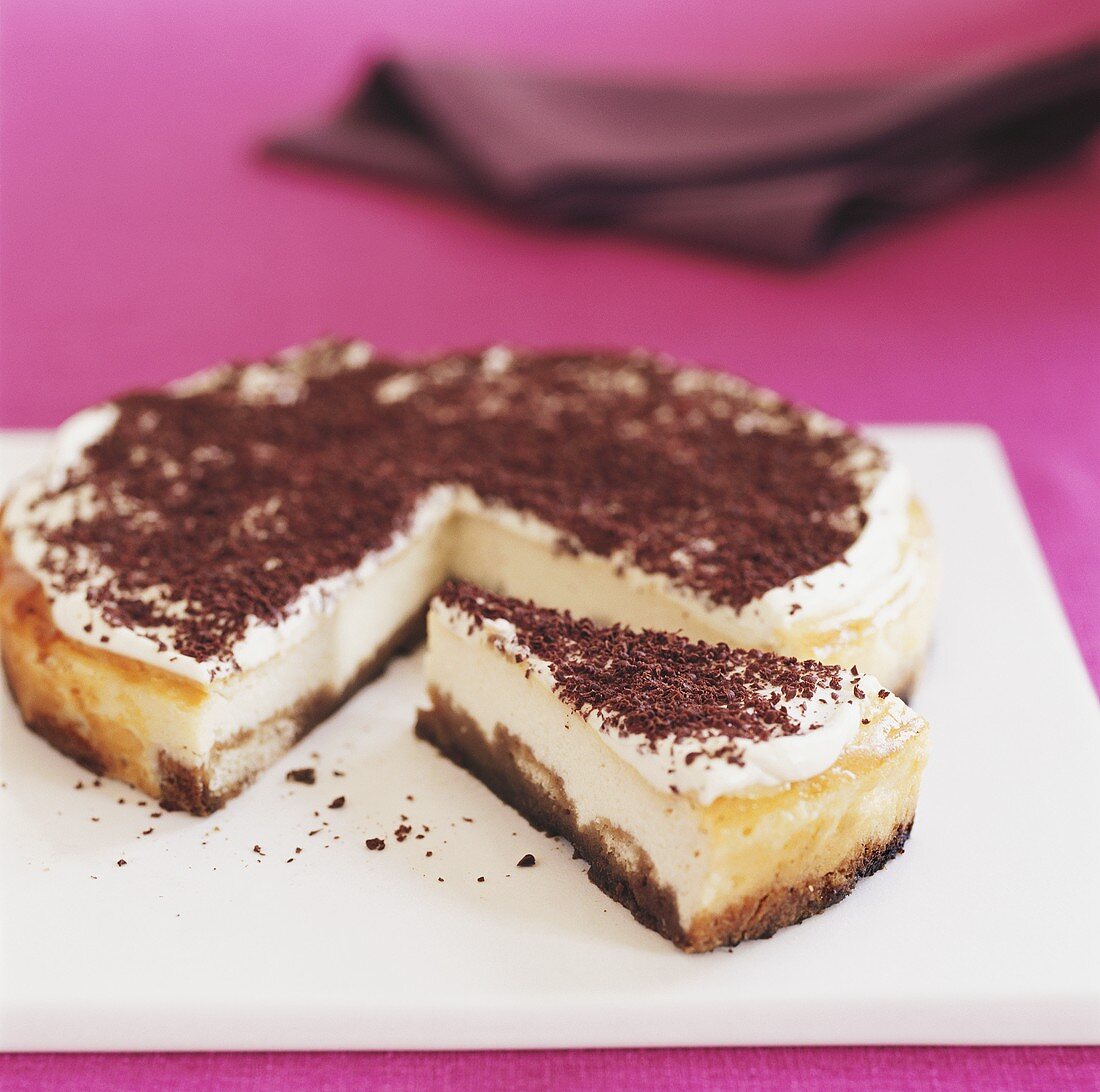 Tiramisu cake, partly sliced