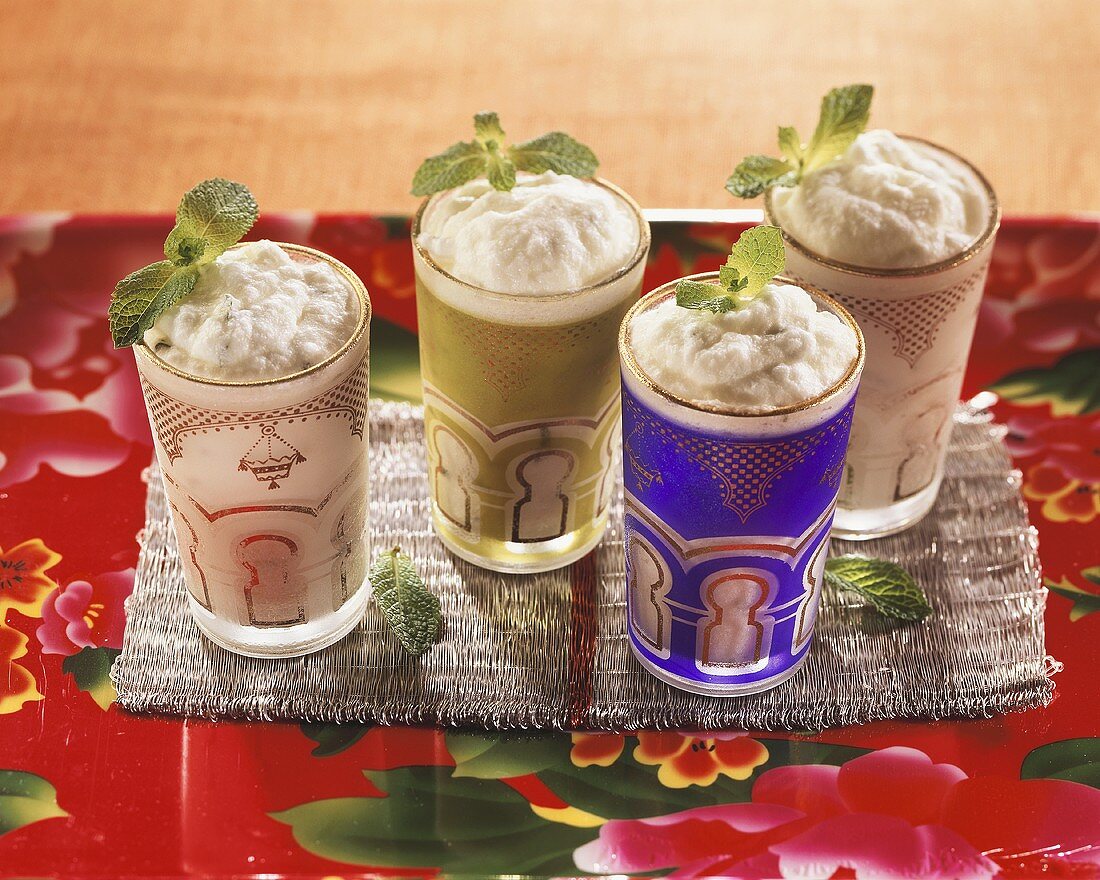 Frozen lime cream with mint in four glasses