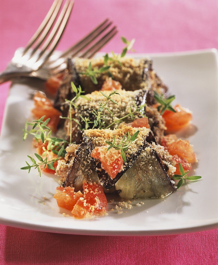 Baked aubergine roulades with tomatoes