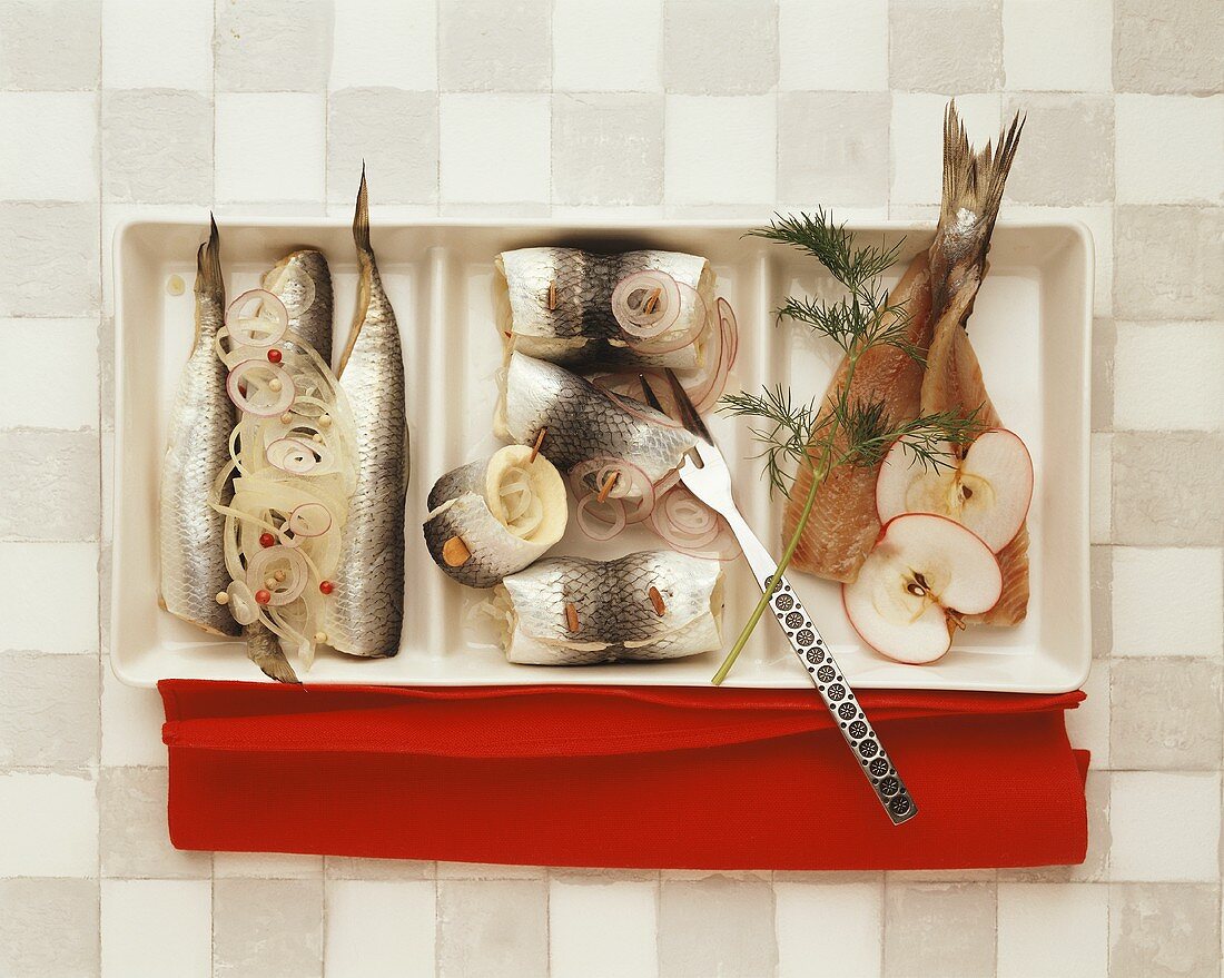Herrings with onions, rollmops, matje herrings with apples