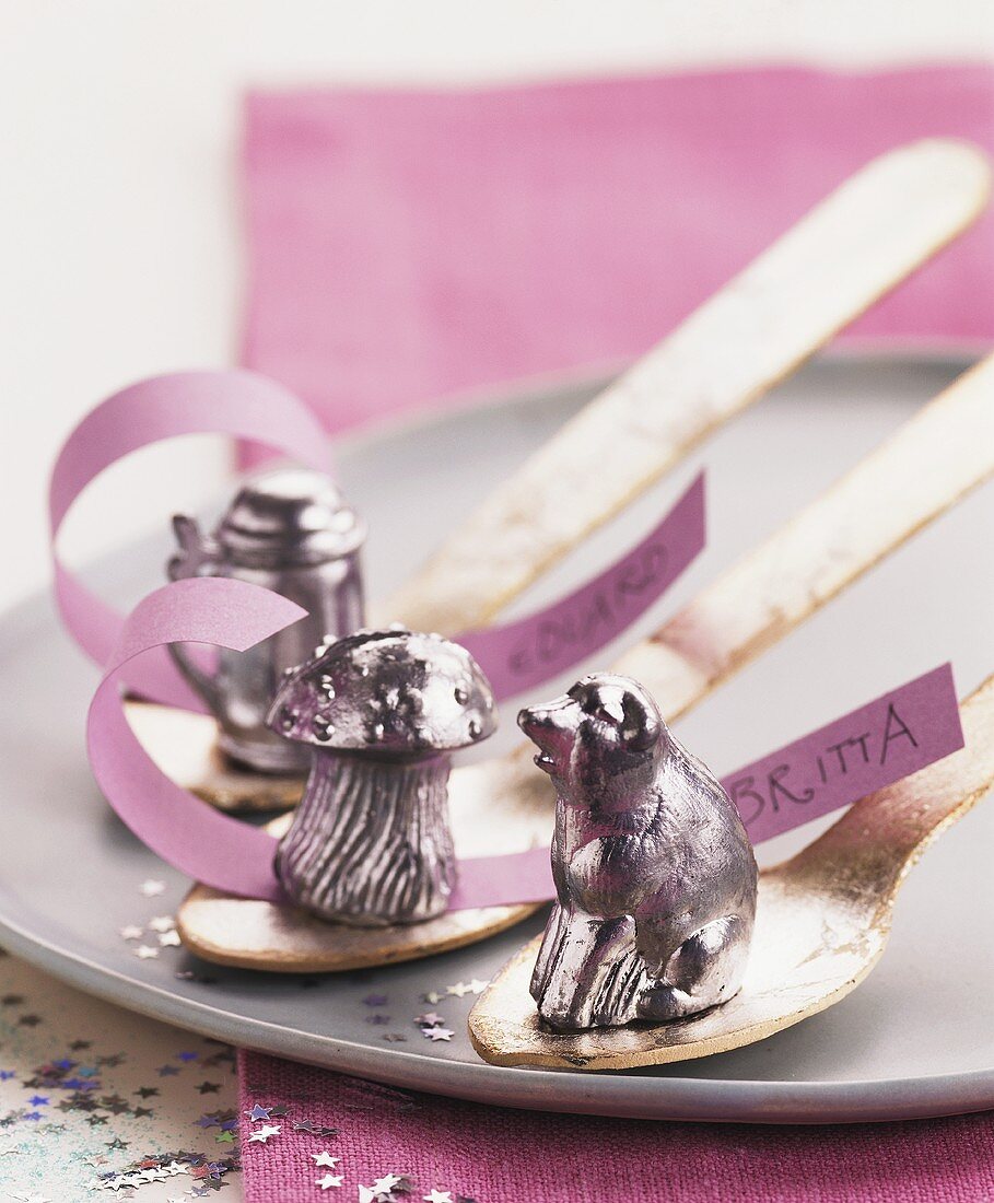 Violet coloured lucky charms on spoons for New Year's Eve