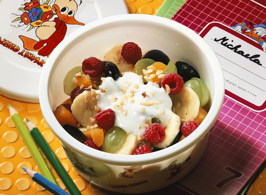Fruit salad with cream yoghurt for schoolchildren