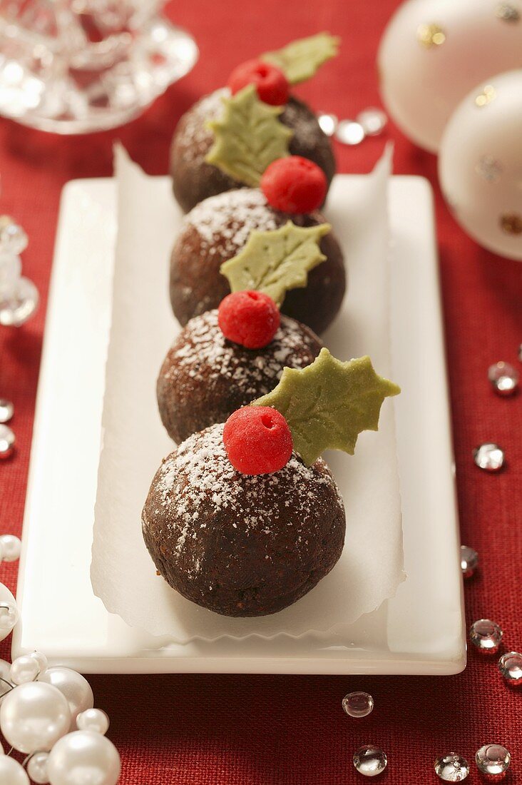 Chocolate Xmas puddings with marzipan leaves & berries