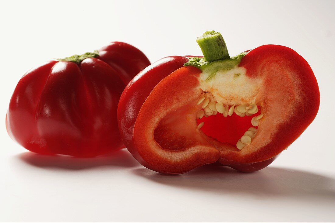 Two peppers, one halved