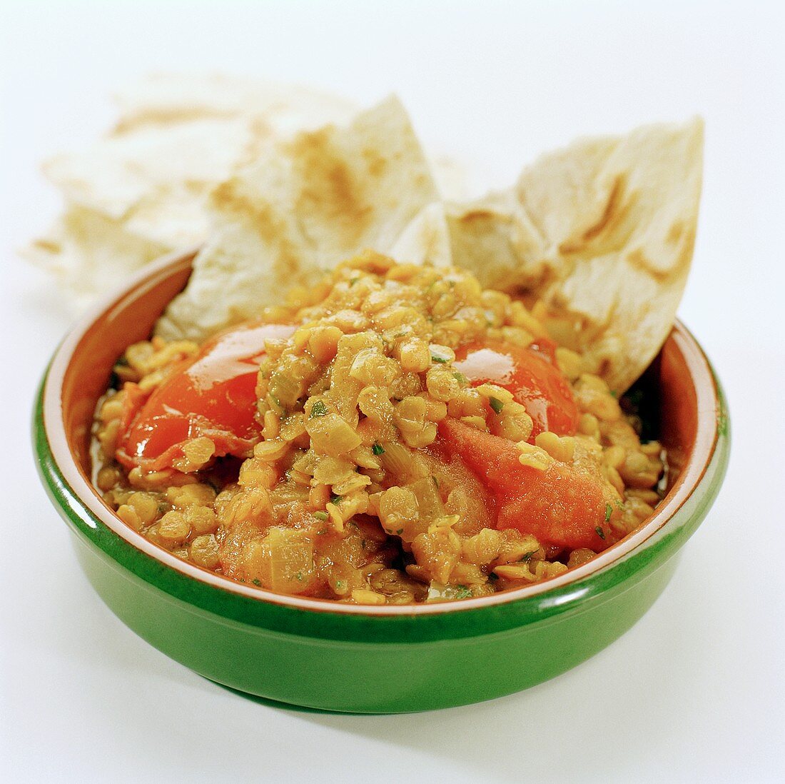 Bohnen mit Linsen, Tomaten und Fladenbrot