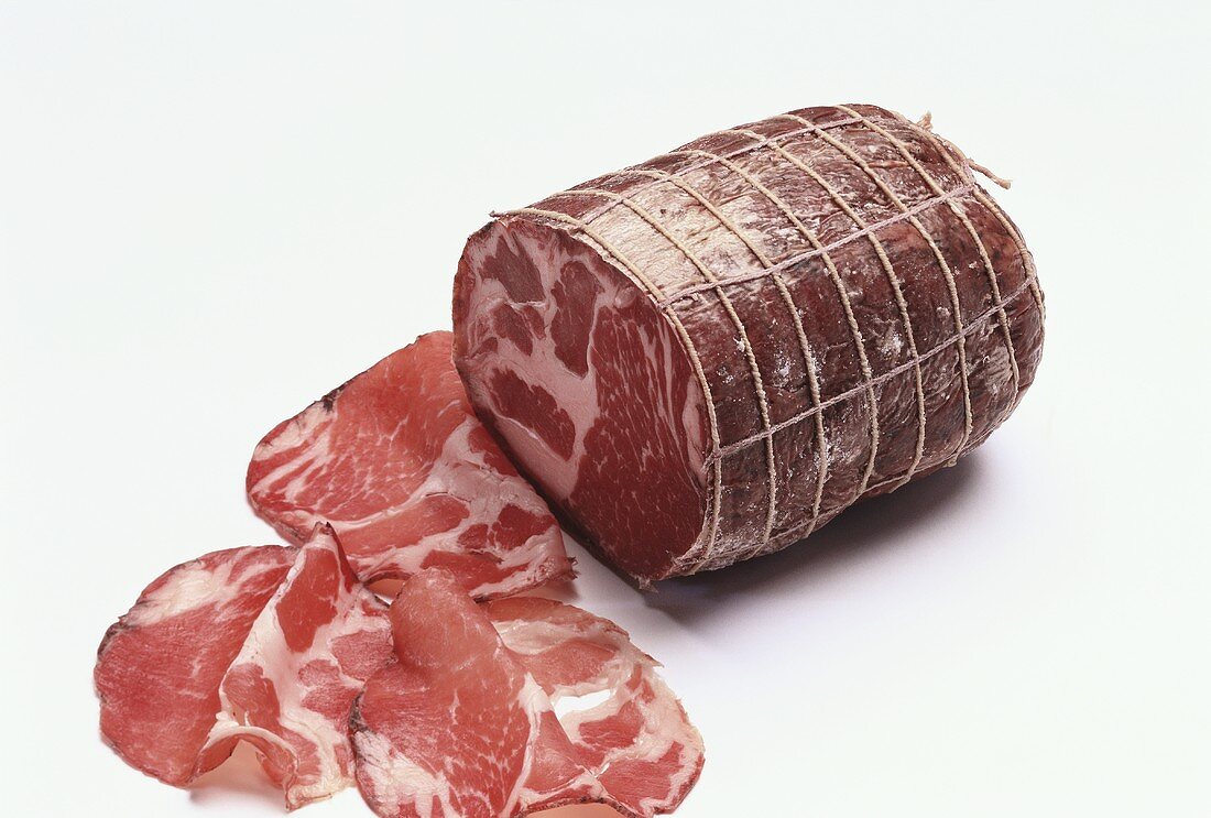 Coppa ham, partly sliced