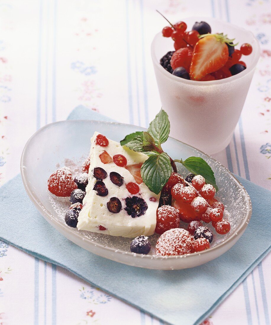 Yoghurt terrine with red berries and icing sugar