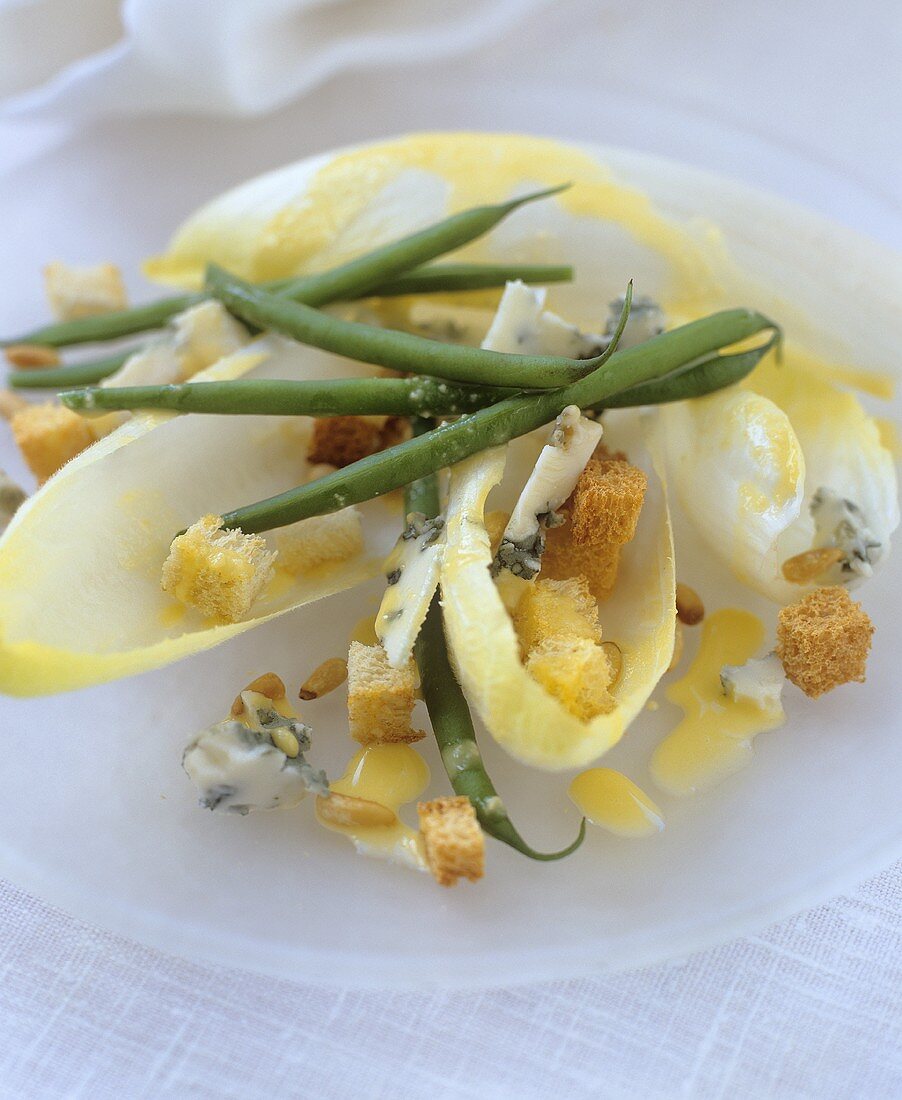 Chicory salad with beans, blue cheese and croutons