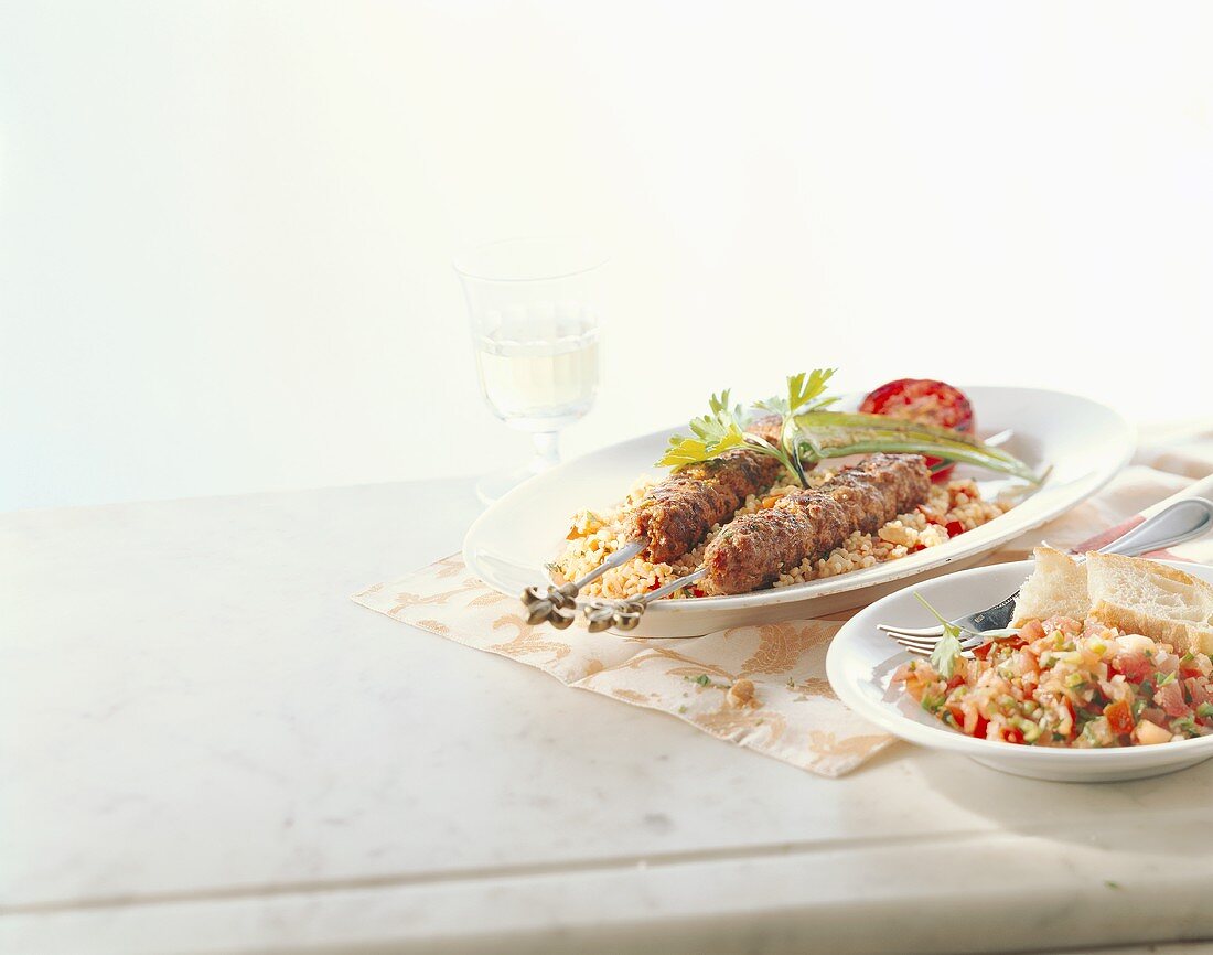 Mince kebabs, pilaw and tomato salad (Turkey)
