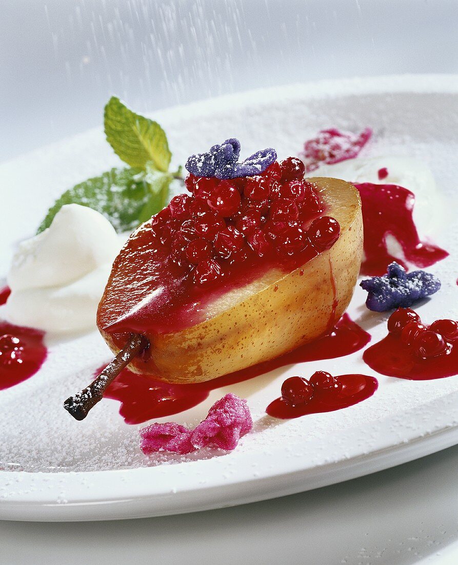 Poached pear with redcurrants