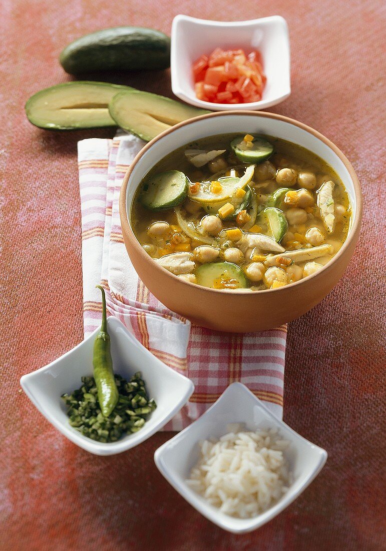 Vegetable soup with avocado, chick-peas and chicken (Mexico)