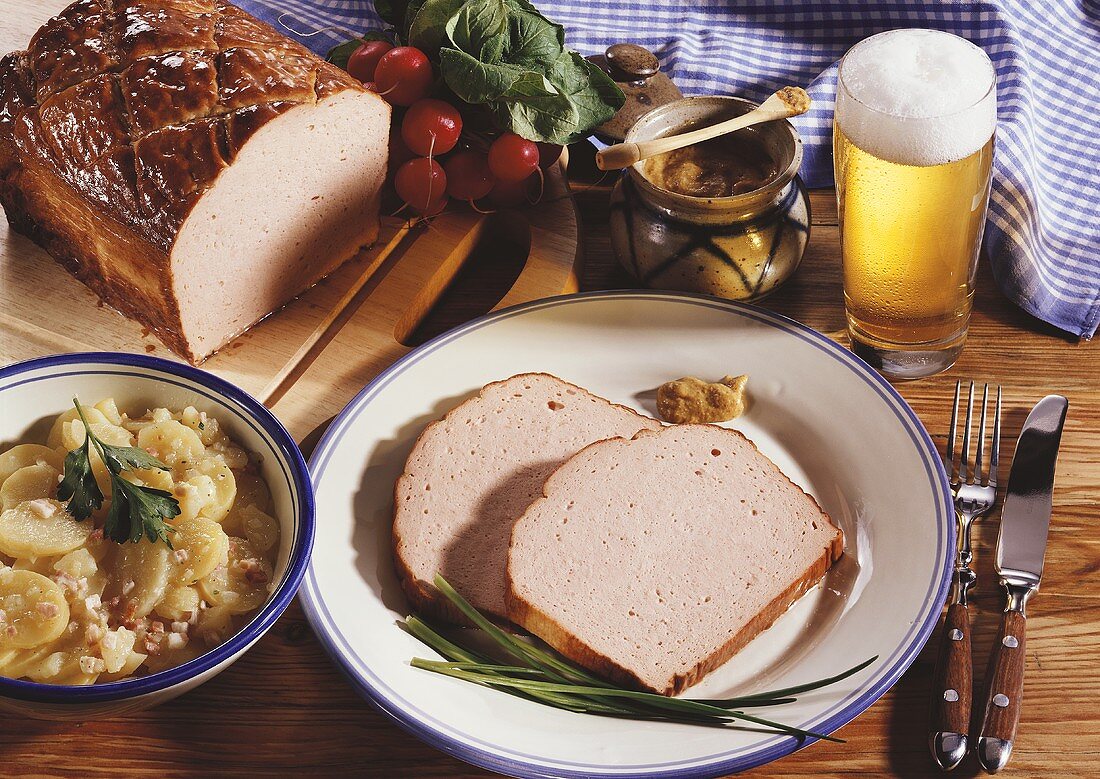 Meatloaf (Leberkäse) with potato salad, mustard and beer