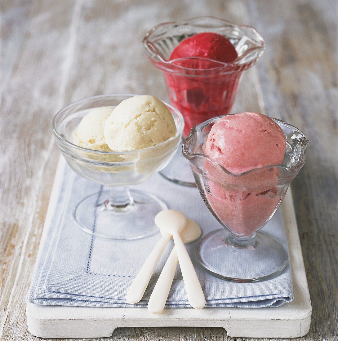 Three different sorts of ice cream in glasses