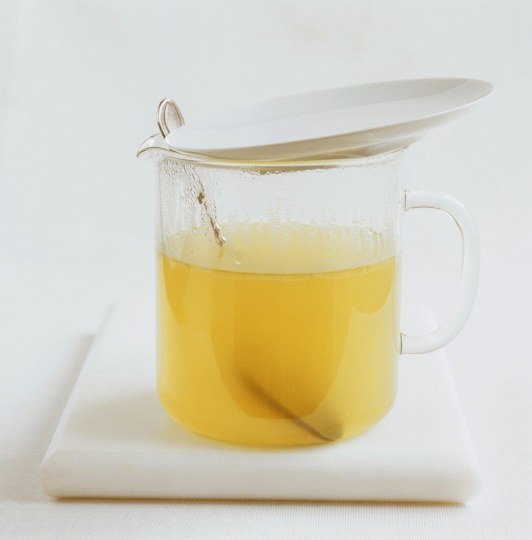 Chicken broth in glass jug