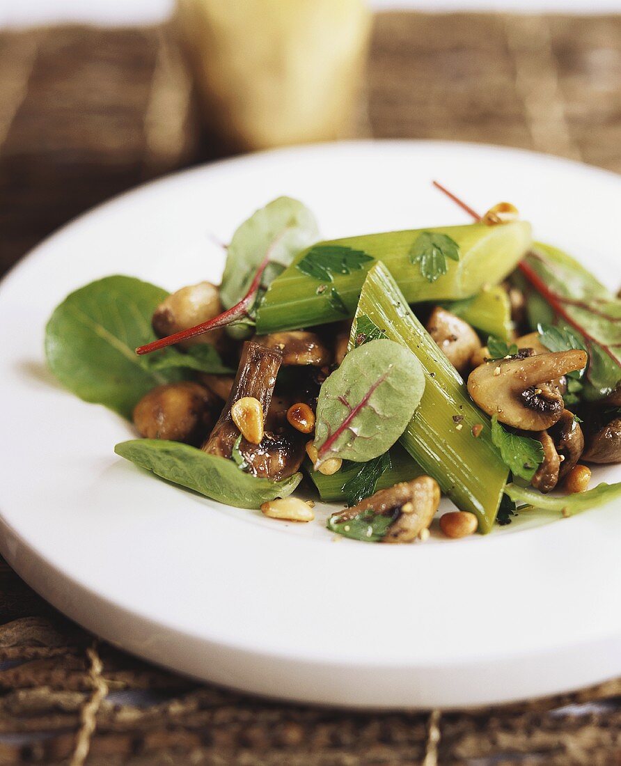 Vegetable salad with mushrooms and pine nuts