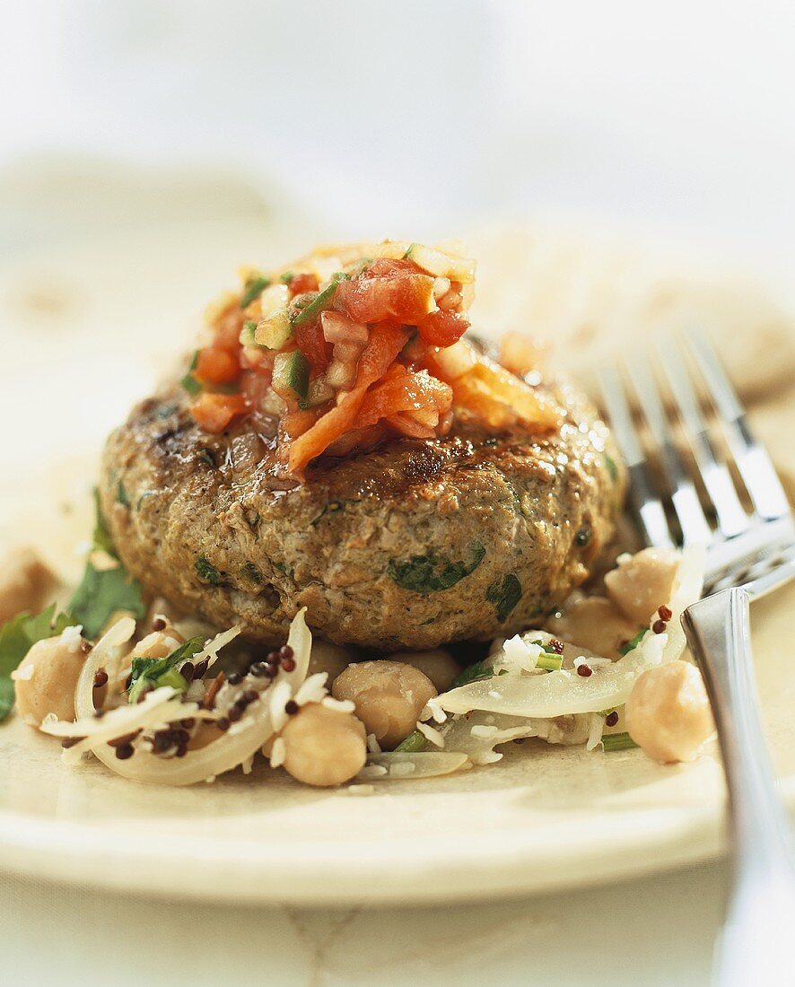 Lamb burger with tomato chutney on bean and fennel salad
