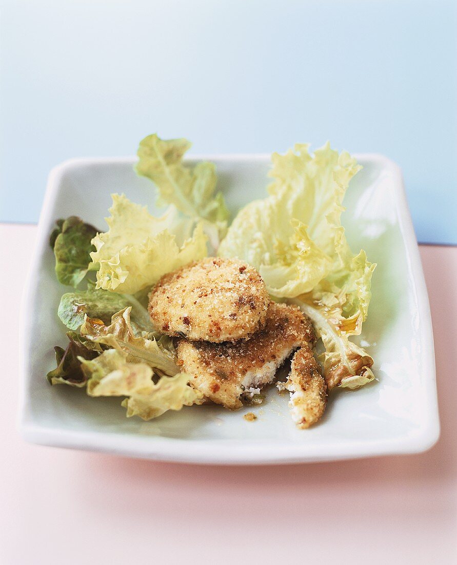 Breaded goat's cheese on salad leaves