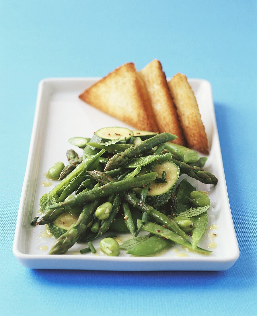 Green summer vegetables with butter sauce & toast triangles