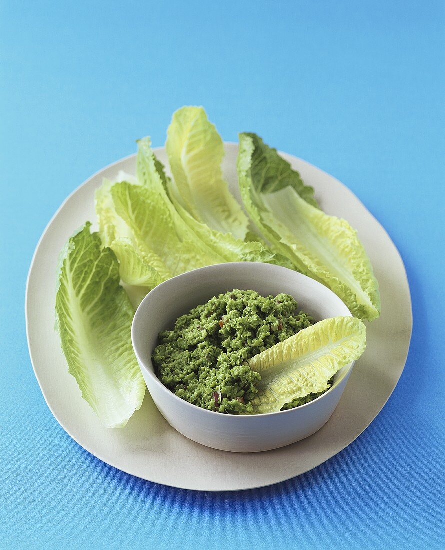 Pea dip with romaine lettuce leaves