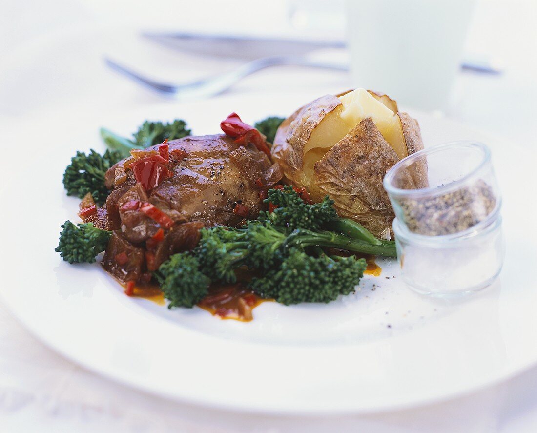 Beef steak with baked potato and broccoli