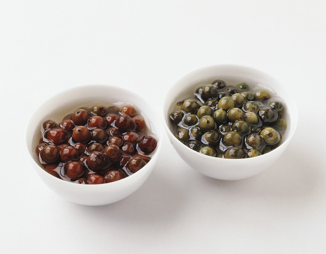 Pickled red and green peppercorns in bowls
