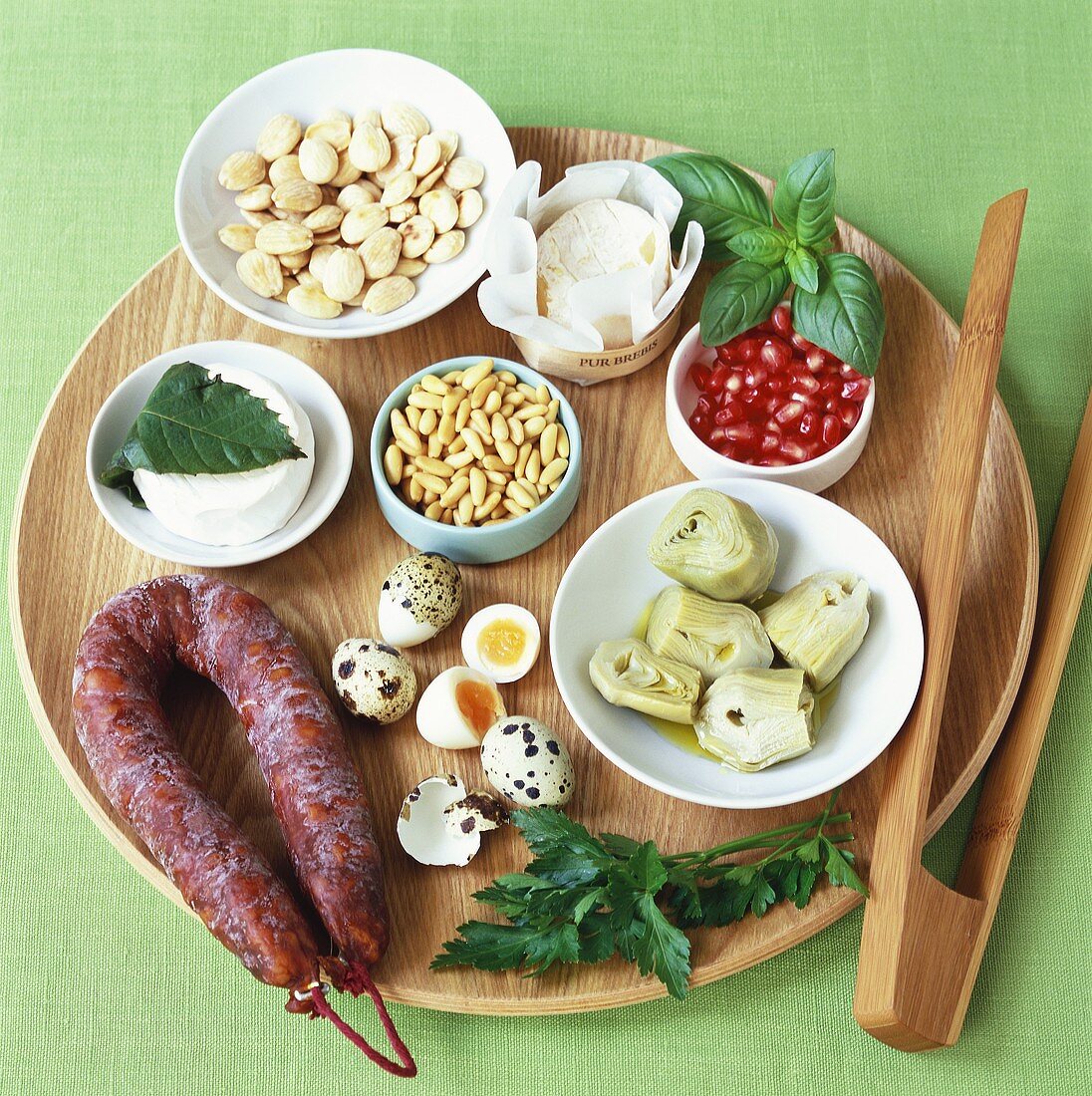Assorted salad ingredients on wooden platter