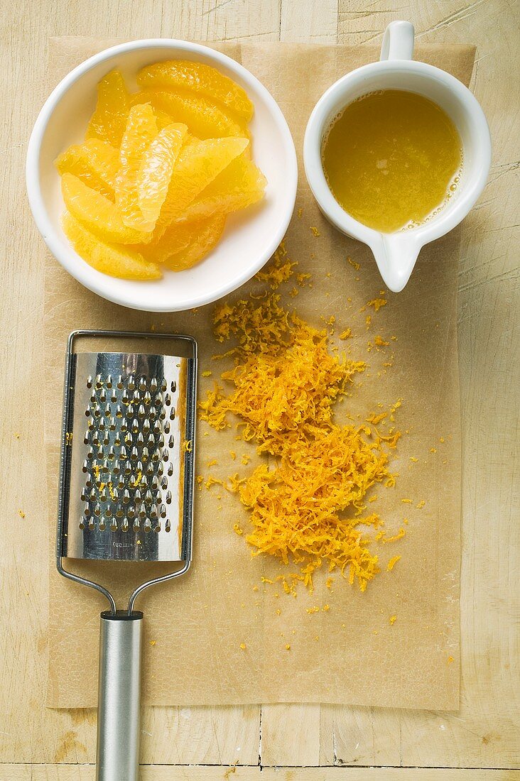 Orange segments, grated orange peel and orange juice