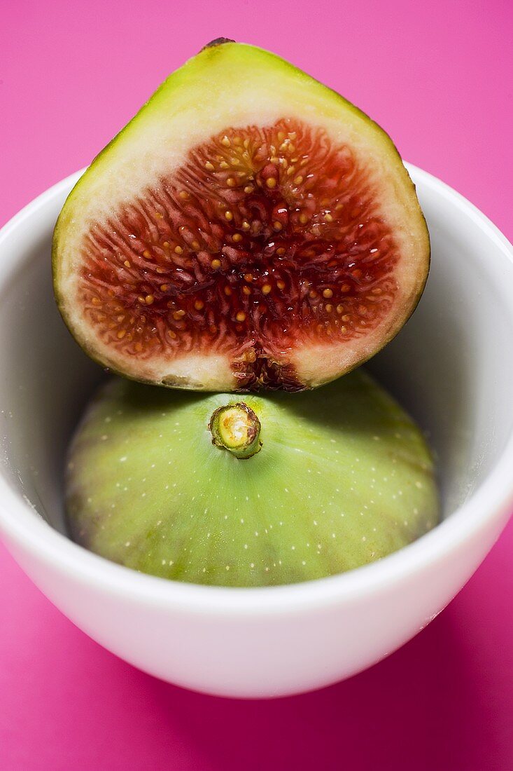 Whole and half fig in bowl
