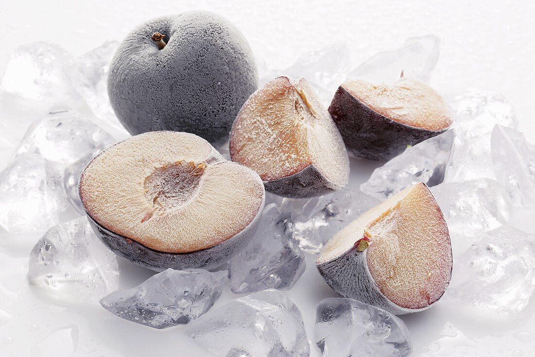 Frozen plums on ice cubes