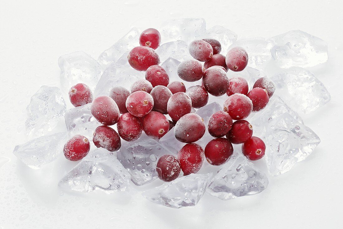 Frozen cranberries on ice cubes