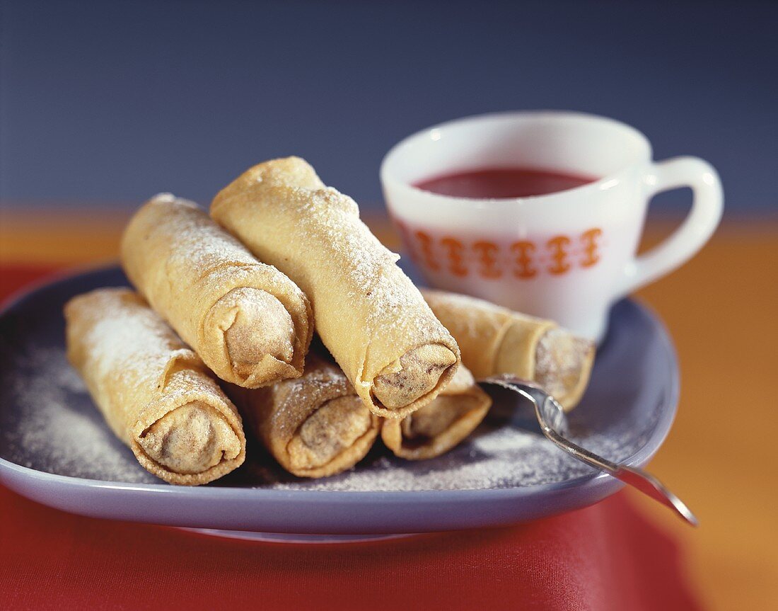 Marzipan chocolate rolls with icing sugar