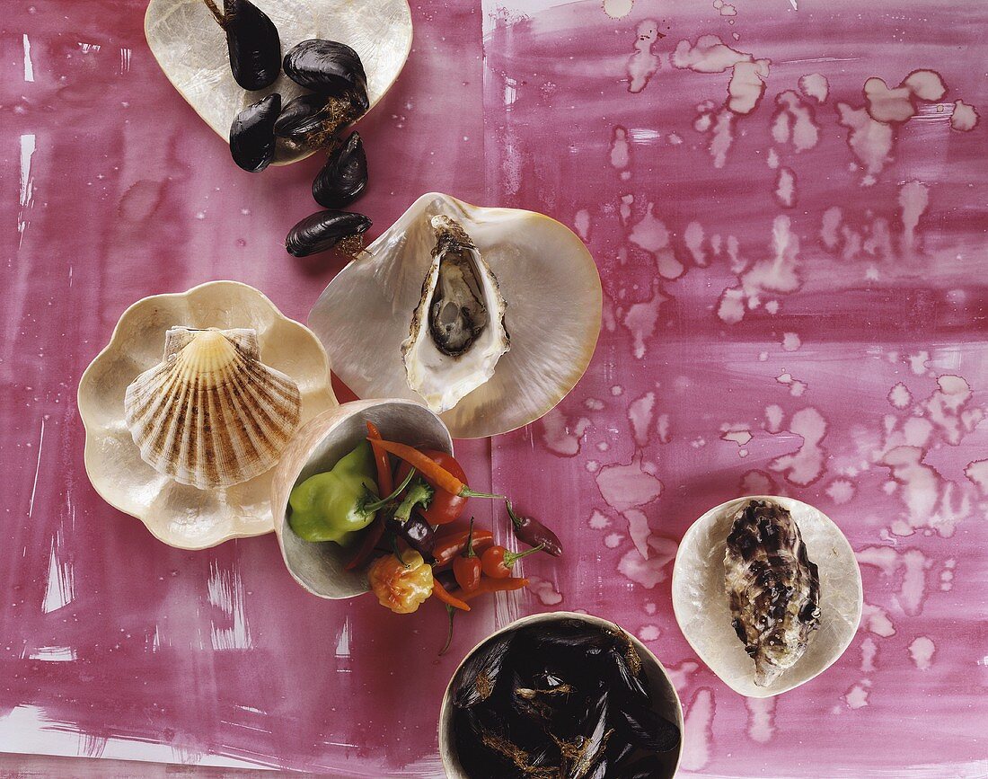 An assortment of fresh shellfish & chillies (overhead view)