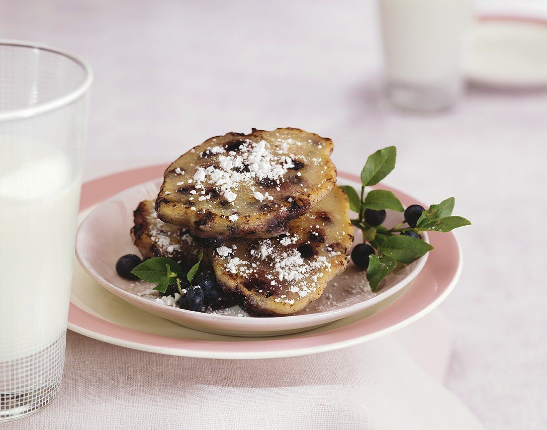 Blueberry dumplings with icing sugar