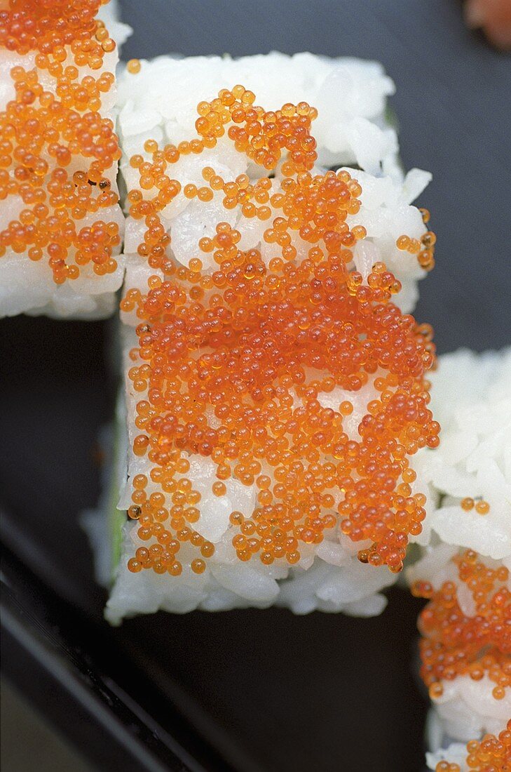 Rice rolls topped with keta caviar