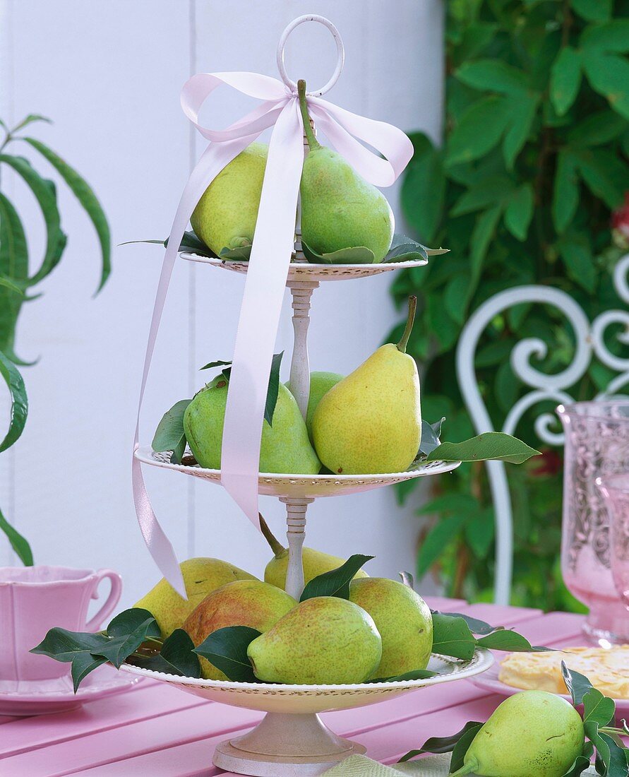 Green pears on tiered stand with bow
