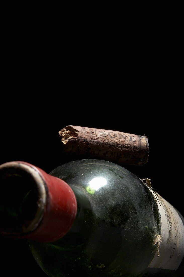 Old red wine bottle with cork